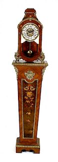 A reproduction walnut and marquetry mantel clock and pedestal, the clock with cellular Roman chapter