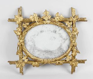 Three assorted mirrors, comprising a small example circa 1800 with plain oval plate within naturalis