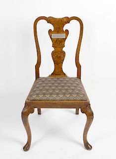 A single early 20th century dining chair, the carved frame with scroll shaped back, the walnut vasul