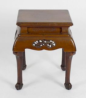 A Chinese carved pine vase stand or occasional table, the moulded rectangular top over recessed carv