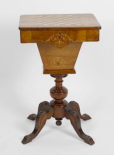 A Victorian inlaid walnut pedestal games/work table, the rounded hinged oblong top with inlaid chess
