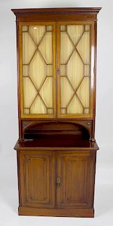 A late Victorian/Edwardian mahogany bookcase cabinet. The upper section with astragal-glazed doors h