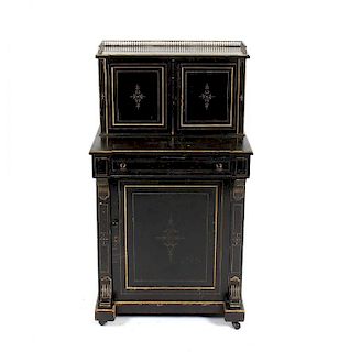 A late Victorian ebonised bonheur-du-jour, the raised twin door, cupboard back, with fitted twin pan