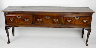 A George III inlaid oak low dresser.Circa.1760-80, the two-plank top over three chequer-strung drawe