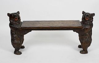 An unusual Black Forest carved wooden bench, each of the end carved bear supports in standing pose,