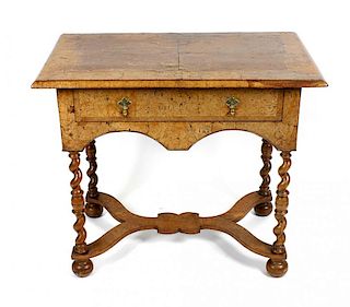 An antique walnut side table, the rectangular top with crossbanded inlay and moulded edge, above a f