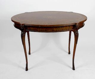 A good late Victorian mahogany inlaid centre table. The oval top having central inlaid motif within