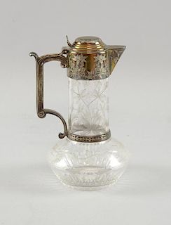 Early 20th Century claret jug, with Aesthetic style decoration, the glass engraved with flowering bl