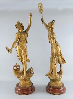 A pair of large French spelter figures representing L'electricite and La Vapeur,, gold painted on fa