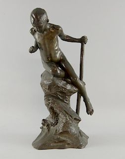Dominico Jollo, Italian, 1866-1938   Bronze figure young boy perched on a rock, signed, 45 cm high