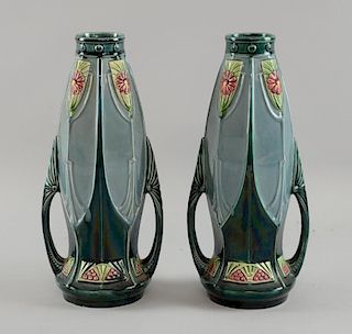 Art Nouveau, pair of twin handled vases with raised decoration in the secessionist style, both numbe