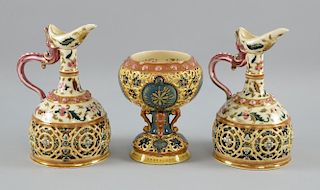 Three pieces of Zsolnay Pecs to include a pair of ewer shaped vases, pierced design with Persian sty