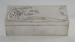 An Art Nouveau silver plated box with floral whiplash design and cedar lining, stamped marks to base