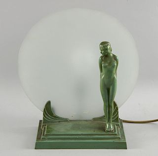 Art Deco lamp, the painted metal base with a nude figure in front of a frosted glass,  Height 33cm
