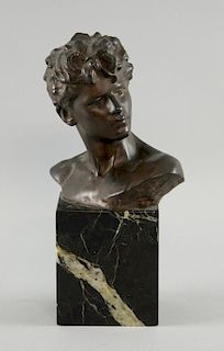 1920's Bronze bust of young man, signature indistinct on variegated black marble base, 24 cm