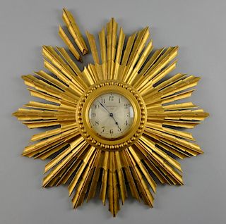 Art Deco giltwood sunburst clock, Bravingtons London. Diameter 40 cm.