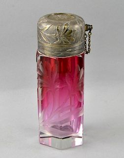 Cranberry glass perfume atomiser,glass atributed to Moser, with cut floral decoration and silver pla