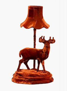 Squint stag table lamp, in rust velvet  23 cm high Note: VAT payable on the hammer price collection