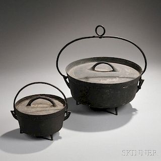 Two Cast Iron Covered Dutch Ovens