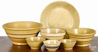Seven yelloware mixing bowls, largest - 5 3/4'' h., 12 1/2'' dia.