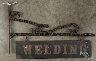 Tin Welding trade sign, early 20th c., with a chain hanger, 28 1/2'' w.