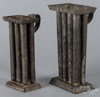 Two tin candlemolds, 19th c., 9 1/2'' h. and 11'' h.