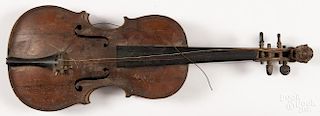 Tiger maple violin with carved lion scroll, 19th c., having a one-piece back, overall - 23 3/4'' l.