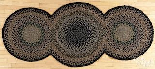 Triple-circle braided rug, 20th c., 7'8'' x 3'5''.