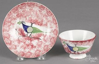 Red spatter peafowl cup and saucer, 19th c.