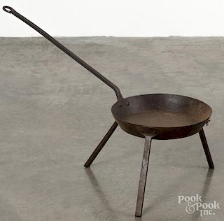 Wrought iron tripod skillet, 19th c., stamped Foster, 28 1/2'' l.