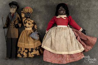 Pair of black Americana walnut head dolls, early 20th c., 12'' h.