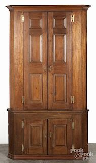 Pennsylvania Chippendale walnut corner cupboard, ca. 1800, in two parts, with raised panels, 95'' h.