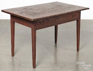 Pennsylvania painted pine tavern table, 19th c., retaining an old red surface, 27'' h., 42'' w.