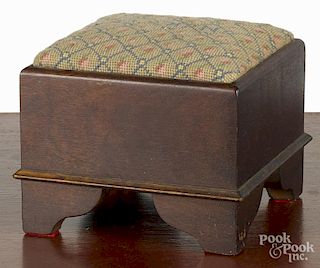 Miniature walnut stool, 20th c., with a needlepoint seat, 6'' h., 7 1/4'' w.