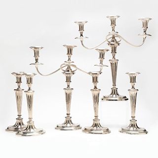 A Set of Four Silverplate Candlesticks and Two Matching Candelabra in the Georgian Style