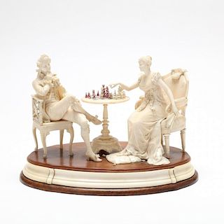 A Continental Carved Ivory Figural Group of a Chess Game