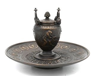 Tiffany and Company Bronze Inkwell, classical urn form with Roman figural relief scene and busts, height 7 inches, diameter 10 inches.
