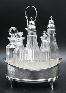 English Silver Cruet Set, with eight bottles, three having silver tops, height 9 3/4 inches.