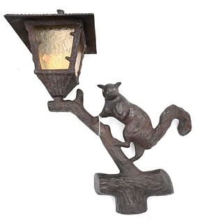 Figural Lamp Post, depicting squirrel climbing a branch, signed at base, height 24 inches, depth 21 inches.