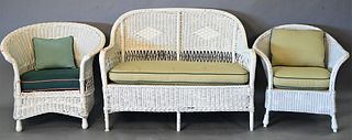 Three Piece Wicker Lot, to include wicker loveseat and two armchairs, all having upholstered cushions, height 33 inches, width 46 inches.