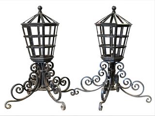 Pair of Large Iron Outdoor Lights, on scrolled iron bases, height 55 inches, width across base 48 inches.