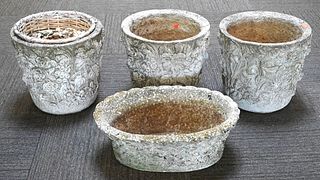 Four Cement Planters, to include three round and one oval, largest height 14 1/2 inches, diameter 15 1/2 inches.