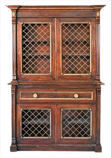 Regency Faux Rosewood Painted Two Part Bookcase, having four grill work doors with metal mounts, height 77 inches, width 51 inches, depth 15 inches.