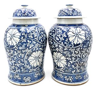Pair of Chinese Porcelain Covered Jars, having painted scrolling vines and flowers, height 17 inches.