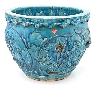 Large Blue Glazed Chinese Planter, having panels molded with phoenix birds and flowers, diameter 20 inches.