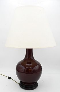 Chinese Sang de Boeuf Glazed Globular Porcelain Vase, made into a table lamp, total height 27 inches, vase height 14 1/2 inches.
