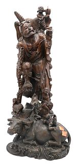 Two Piece Group, to include a Chinese bronze water buffalo with two children, along with a carved wooden figure, height 26 inches.