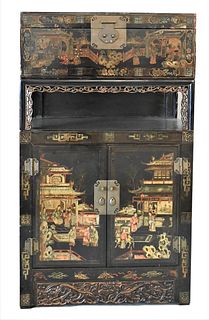Two Part Chinese Lacquered Cabinet, top part having lift top, sitting on base, having two doors, height 58 inches, width 34 inches, depth 20 inches.