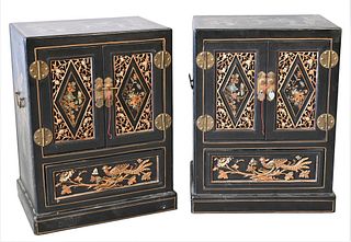 Pair of Decorative Asian Low Cabinets, each having two doors over one drawer, height 27 1/2 inches, width 20 1/2 inches.