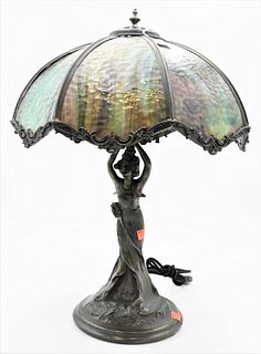 Art Nouveau Figural Table Lamp, having slag glass shade, on standing woman metal base, height 22 inches.